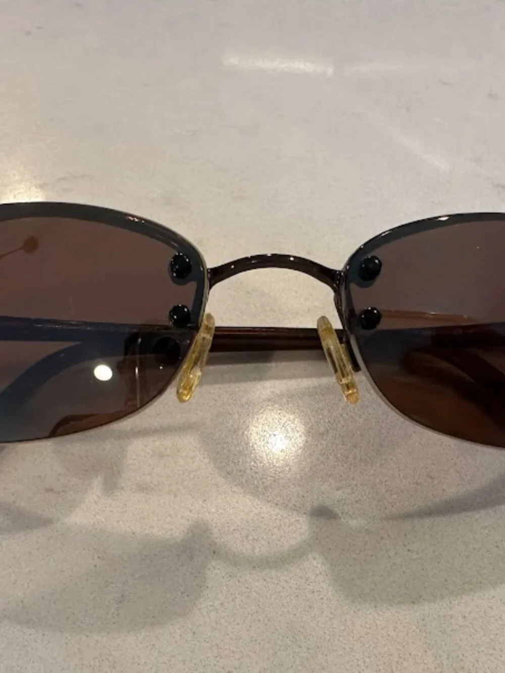 Maui Jim Brown Lens Oval Sunglasses with Gold Nose Pads and Dark Brown Frame